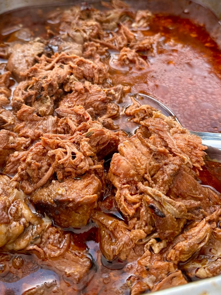 Braised lamb in a stock reduction, served over rice